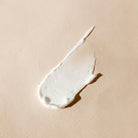 aeolis urea foot cream smear on a beige background