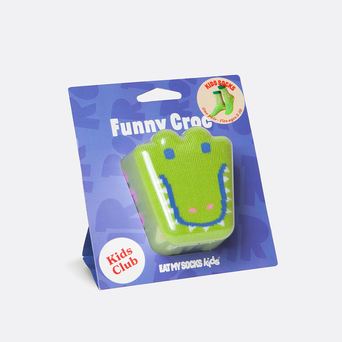 Green crocodile-shaped product in packaging with 'Kids Club' branding on a white background
