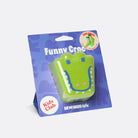 Green crocodile-shaped product in packaging with 'Kids Club' branding on a white background