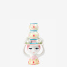 Bjorn Wiinblad lady with hat candeholder pink and yellow on a white background