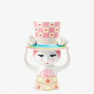 Bjorn Wiinblad Lady with hat vase pink and yellow on a white background