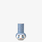 Decorative Bjorn Wiinblad candle holder with a face design on a white background