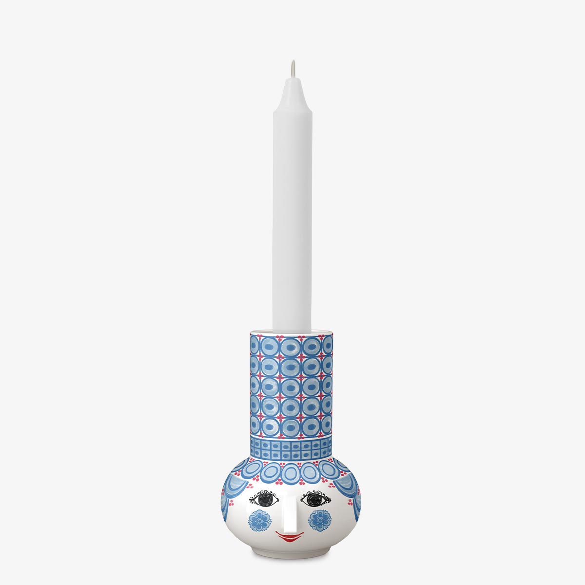 Decorative Bjorn Wiinblad candle holder with a face design on a white background