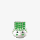 Bjorn Wiinblad ceramic candle holder with a face design and green pattern on a white background