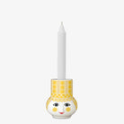 Bjorn Wiinblad Olga Candleholder yellow with candle on a white background