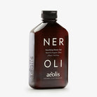 Brown bottle of aeolis Neroli shower gel on a white background